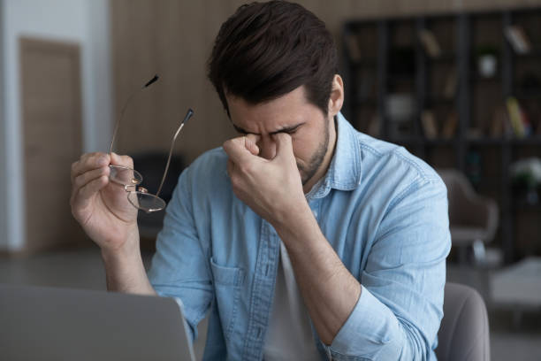 istock Close up tired businessman taking off glasses, computer vision syndrome 1319095473
