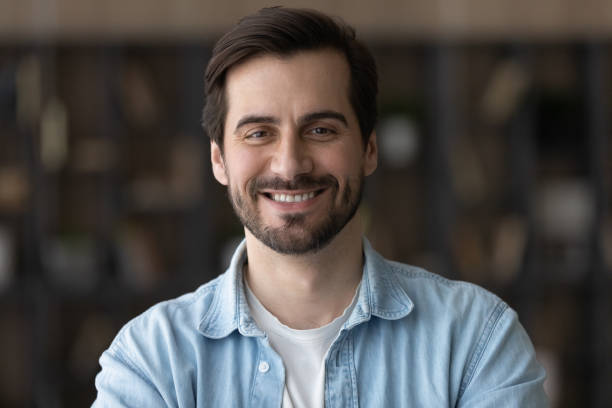 istock Head shot portrait smiling confident man looking at camera 1319095687
