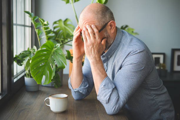 istock mature adult man working from home office ( negative emotion ) 1319101686