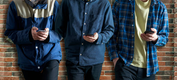 istock people crowd holding and using phones. modern 5g technology communication 1319101852