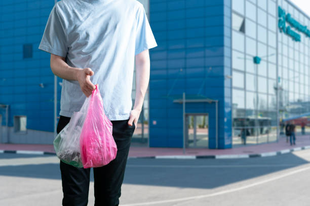 istock person holding a plastic bag, reused recycling concept 1319101862