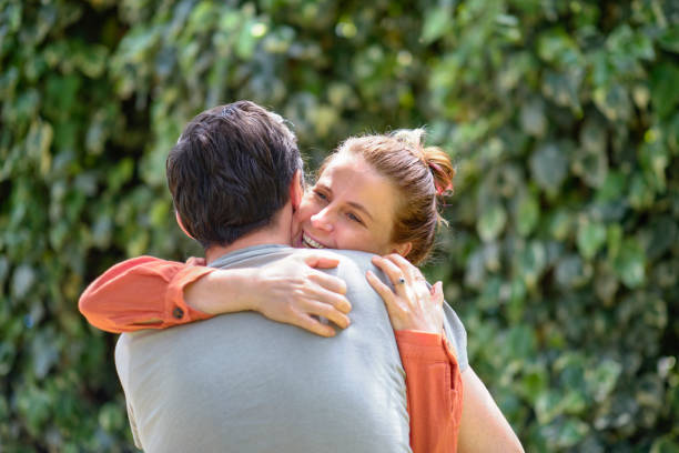 istock Affectionate young couple bonding together outdoors 1319102299