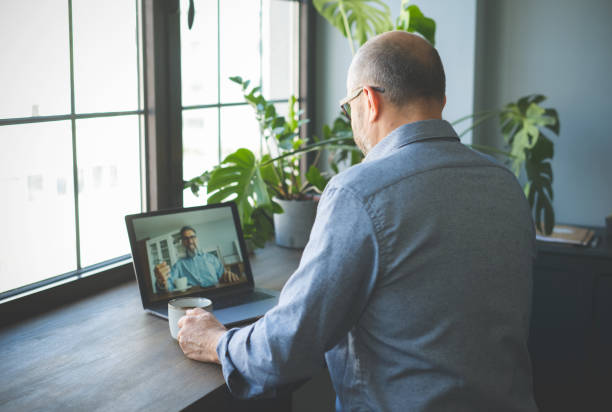 istock mature adult man working from home office ( with laptop,Video Conference) 1319102571