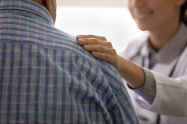 istock Caring clinic worker comfort anxious sick man patient inspire optimism 1319103341