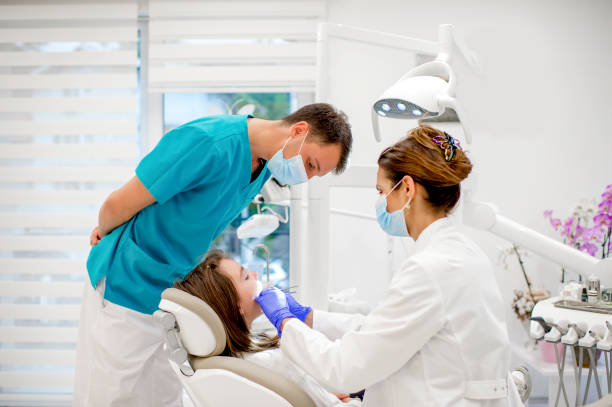 istock Beautiful girl at the dentist 1319106055