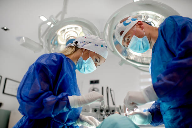 Dental team performing procedure stock photo