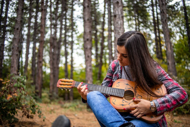 istock A young woman enjoys a beautiful spring day in nature. 1319109593