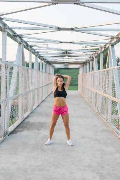 istock Young athlete woman stretching outdoor before a workout 1319109789