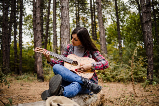 istock A young woman enjoys a beautiful spring day in nature. 1319109941