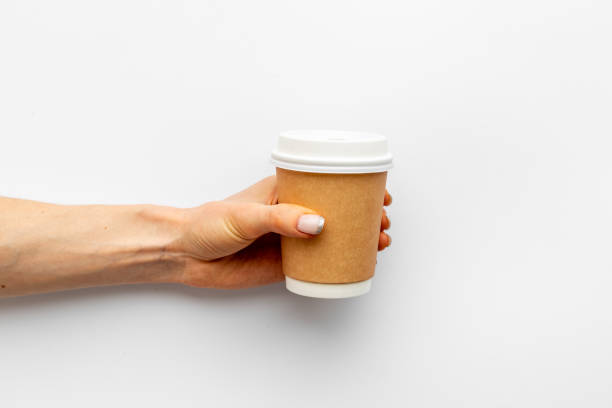 istock Paper cup with coffee in hand. Coffee take away concept 1319112234