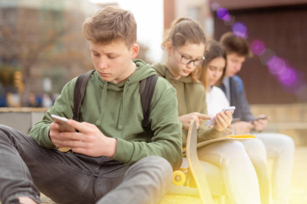 istock Teenagers chatting on their smartphone on walking 1319112317