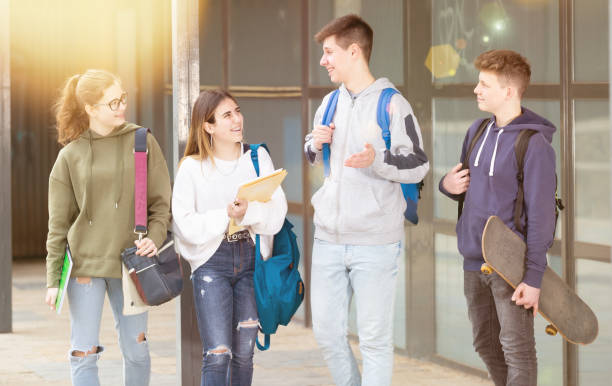 istock Teenage students talking outside after lessons 1319112320