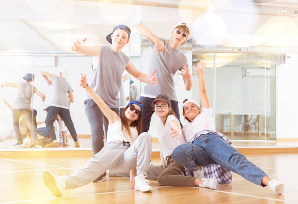 istock Group of dancing teenagers posing in dance studio 1319112347