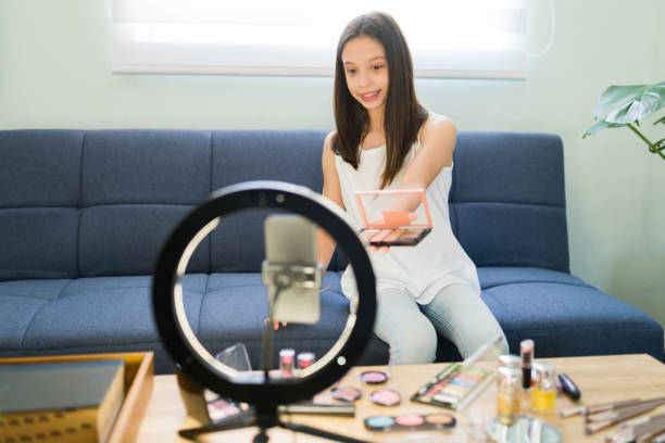istock Beauty blogger putting on makeup for a video 1319112605