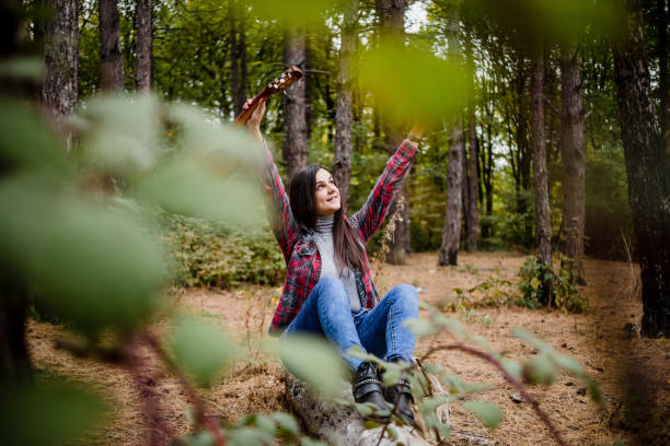 istock A young woman enjoys a beautiful spring day in nature. 1319113848