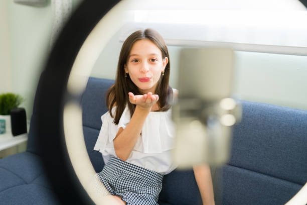 istock Cute influencer giving love to her subscribers 1319113921
