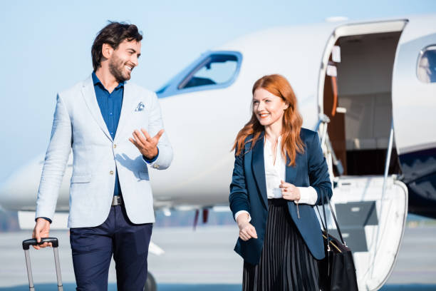 istock Happy coworkers disembarking corporate jet 1319115900
