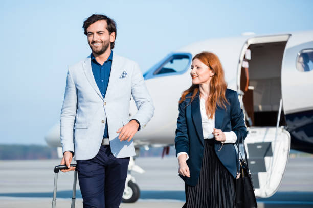 istock Confident coworkers disembarking corporate jet 1319117118