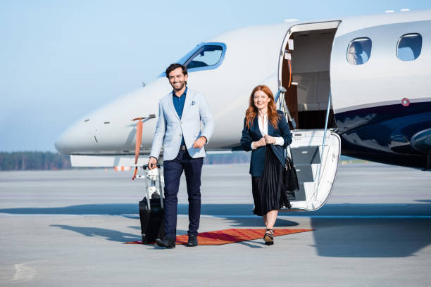 istock Confident colleagues disembarking private jet 1319117407