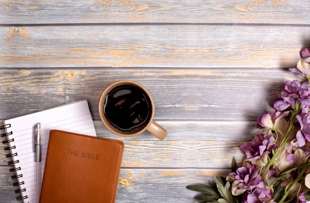 istock Single Bible and Cup of Coffee on a Distressed Wooden Table 1319119401