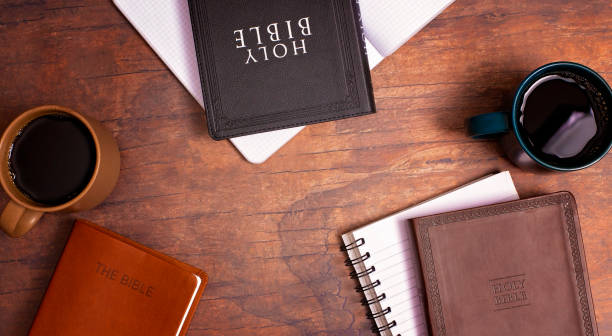 istock Group Bible Study with Hot Coffee on a Distressed Red Wood Table 1319119404