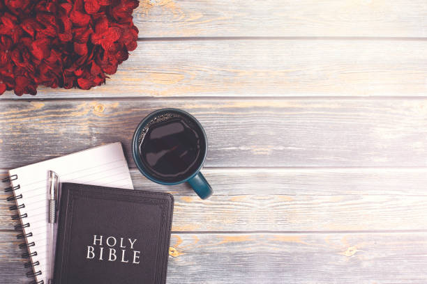 istock Single Bible and Cup of Coffee on a Distressed Wooden Table 1319119410