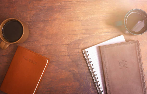 istock Group Bible Study with Hot Coffee on a Distressed Red Wood Table 1319119468