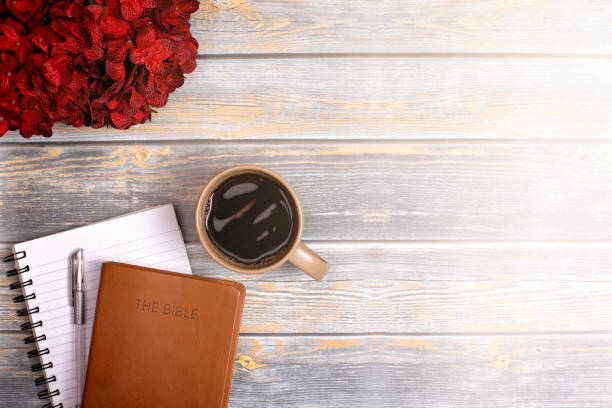 Single Bible and Cup of Coffee on a Distressed Wooden Table