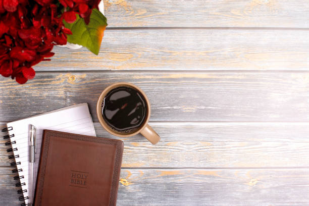 istock Single Bible and Cup of Coffee on a Distressed Wooden Table 1319119489