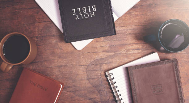 istock Group Bible Study with Hot Coffee on a Distressed Red Wood Table 1319119568