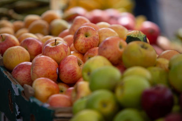 istock Bunches of different apples at a market 1319120105