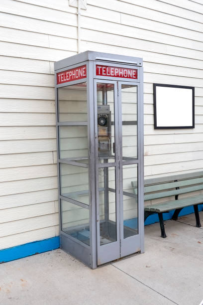 istock Old Telephone Booth With Blank Sign 1319125103