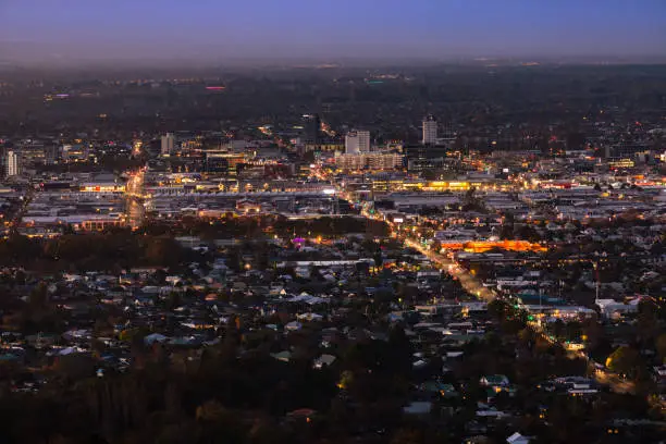 This May 2021 image taken at dusk shows the central business district of Ōtautahi Christchurch, Aotearoa New Zealand. The city is the largest on Te Waipounamu South Island. Colombo St is the main road in this image. Photographed from Cracroft Reserve in the Port Hills along the Banks Peninsula.