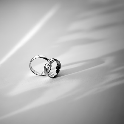 Pair of gold wedding rings. Wedding agency concept photography.