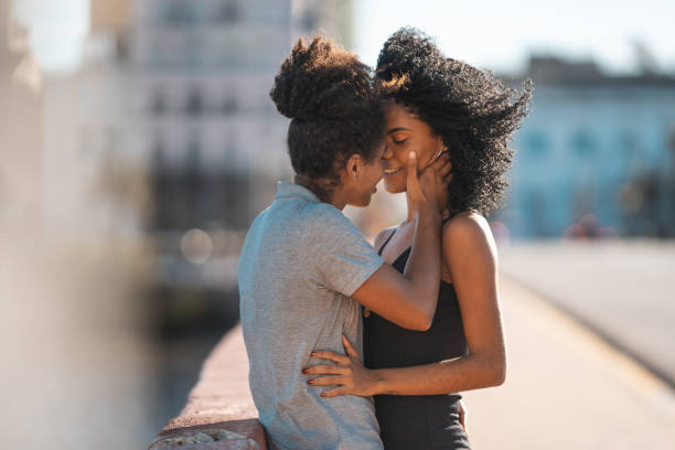 Lesbian couple kissing on the mouth outdoors Only Women, Lesbian, LGBT, Gay Couple, Love bisexuality stock pictures, royalty-free photos & images