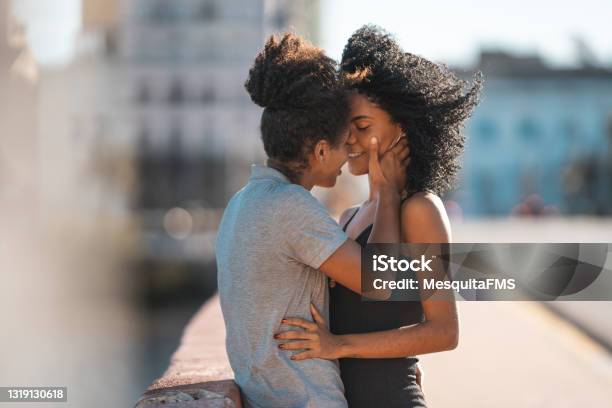 Lesbian Couple Kissing On The Mouth Outdoors Stock Photo - Download Image Now - Kissing, Lesbian, Gay Person