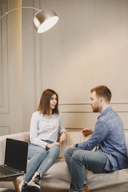 istock Young woman talking with her male pschycologist 1319132117