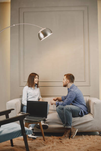 istock Young woman talking with her male pschycologist 1319132121