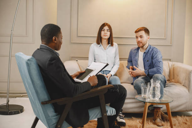 istock Couple at pshycologist appointment sitting in modern office 1319132126