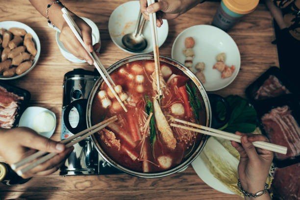 istock happy asian family talking while having lunch at dining table 1319139146