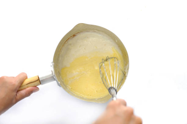 istock beat the dough using an egg beaten - mengocok adonan 1319142701