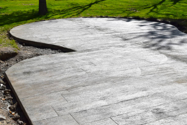 istock Backyard Patio Construction with a Concrete Cement Foundation by Builders for a Stamped Patterned Surface 1319145068