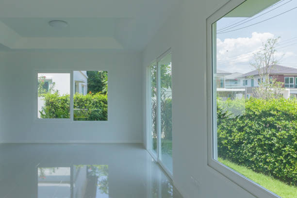 istock Empty room with glass window frame house interior on concrete wall 1319145279