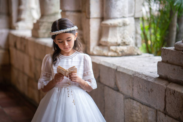 istock Hispanic girl reading her bible 1319151699