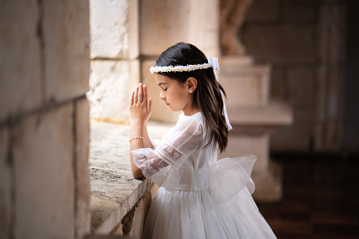 Hispanic girl praying