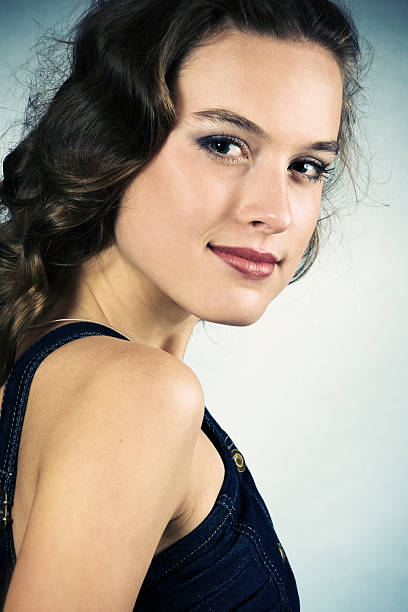 Portrait of a smiling pretty young girl with long hair stock photo