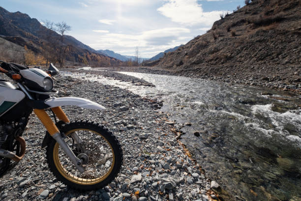 istock Offroad enduro motorcycle in mountains near the river 1319154510