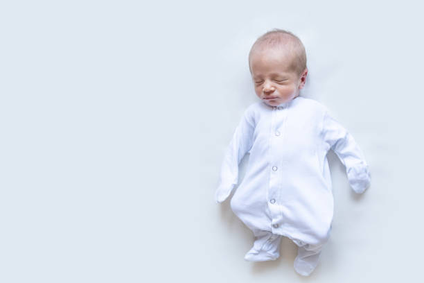 istock newborn sleeping baby on a white background 1319156662