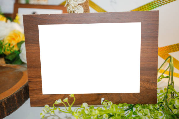 istock Wooden frame in table and flower stock 1319160691
