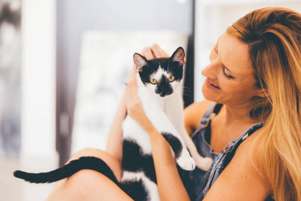 istock Playful Caucasian Woman with her Cat 1319161803